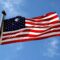 An American flag waving on a flagpole